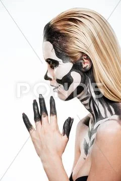 Profile of girl with terrifying halloween makeup Stock Photos