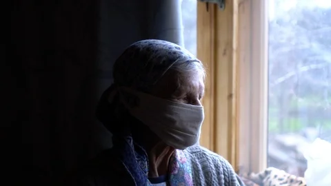 Profile of granma at window Stock Footage 127456555