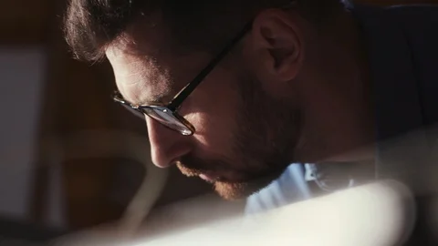 Profile of hardworking architect thinking and creating an architectural sketch 스톡 동영상 107423657