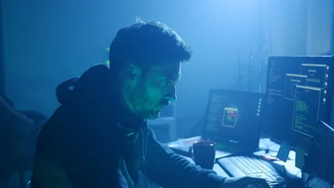 Profile of hardworking computer hacker hacking the server typing on keyboard in Stock Footage 108819515