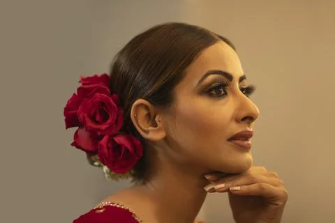 Profile of an Indian bride during the make up session	 Stock Photos