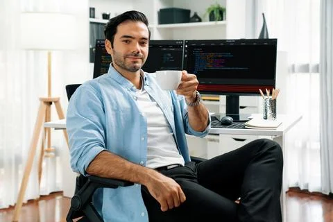 Profile IT looking camera holding coffee cup against coding on pc. Surmise. Stock Photos