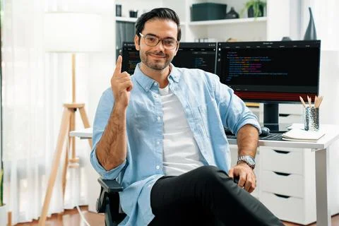 Profile IT looking camera wearing glasses against coding on pc. Surmise. Stock Photos