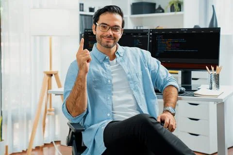 Profile IT looking camera wearing glasses against coding on pc. Surmise. Stock Photos