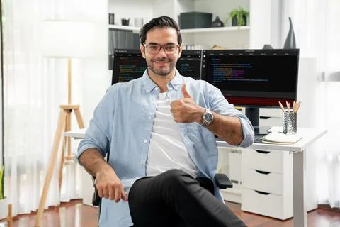 Profile IT looking camera wearing glasses against coding on pc. Surmise. Stock Photos