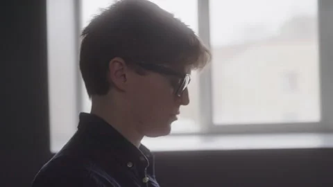 The Profile of a Male Coder as He Writes Code at Work Stock Footage 208785434