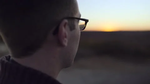 Profile Of Man Enjoying View Of Sunset, He Takes A Photo With His Smart Phone Stock Footage 57175573