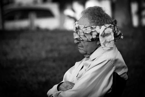 Profile of a man seated with blindfold. Stock Photos