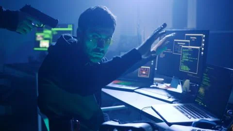 Profile of man trying to hack server and steal important data on laptop. Hacker Foto stock