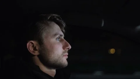 Profile of man's face while driving a car on the highway Stock Footage 83241182