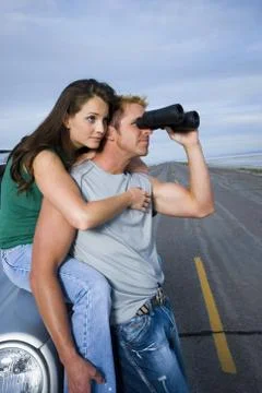 Profile of a mid adult man and a young woman Stock Photos