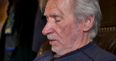 Profile of an old man talking, explaining something or telling a story Stock Footage 120249146