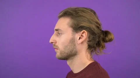 Profile portrait of long-haired courageous man 4K Stock Footage 145363853