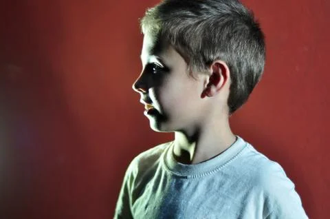 Profile portrait of a small boy seeing light Stock Photos