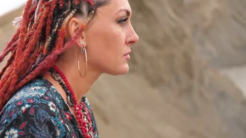 Profile portrait of a woman with dreadlocks in boho style. Close-up Stock Footage 290175326