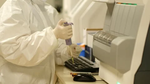 Profile of scientist testing test tube with blood sample to coronavirus Stock Footage 241740182