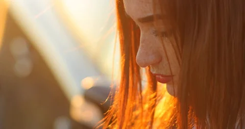 Profile of serious face of red-haired young woman with freckles Stock Footage 129324539