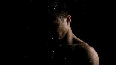 Profile of a Serious Man Looking Down in the Rain and Darkness Video stock 270310407