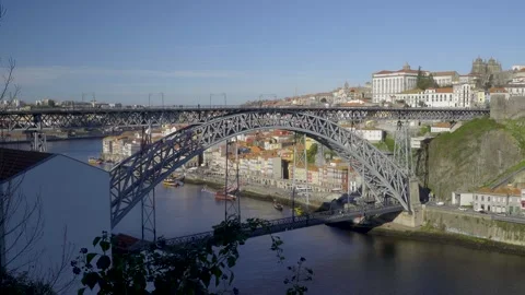 Profile shot of the Dom Luis I Bridge arch over the Douro river. Stock Footage 327624775