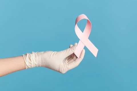 Profile side view closeup of human hand in white surgical gloves shwoing and  Stock-Fotos
