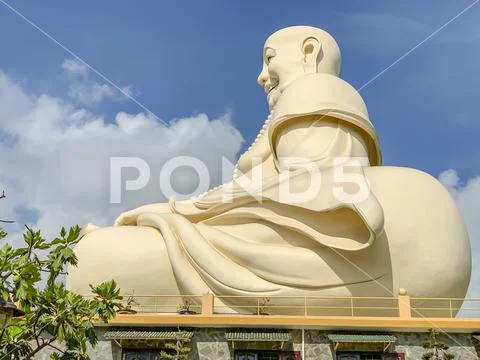 Profile of sitting Buddha at Vinh Trang Pagoda in My Tho Vietnam Stock Photos