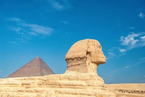 Profile of a sphinx on a blue sky background Stock Photos