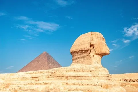 Profile of a sphinx on a blue sky background Stock Photos