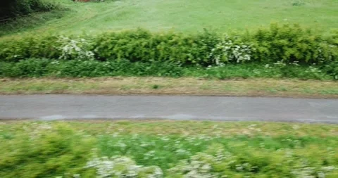 Profile Tracking Drone Shot of a man on a motorbike. 库存影片 242584441