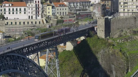 Profile view of the bridge crossing the Douro River towards Ribeira. Stock Footage 327624520