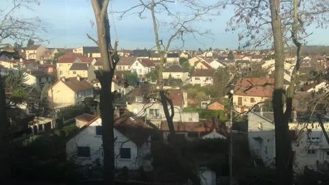 Profile view of a city from a train heading towards Paris, France. Stock Footage 265362922