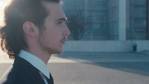 Profile view, close-up of the face of a young man in a stylish classic business 库存影片 330669058