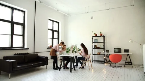 Profile view of a couple of adults working on a painting at an art school 4k 20s Stock Footage 72853294