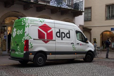 Profile view of dpd logo on delivery truck by mercedes parked in the street Stock Photos
