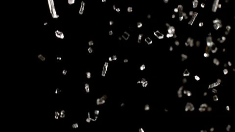 Profile view of Glass breaking in slow motion on black background Stock Footage 126214974