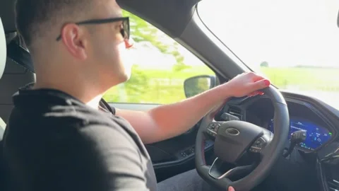 Profile view of man driving car Stock-Footage 336458558