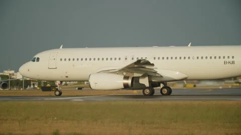 Profile view of a standing passenger plane with turbines running on the run.. Stock Footage 249274232