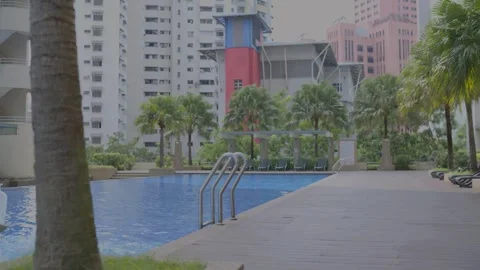Profile view of swimming pool of hotel with steel stair ladder. Day view. Stock Footage 292109533