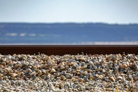 Profile view of train rail on hot summer day Stock Photos