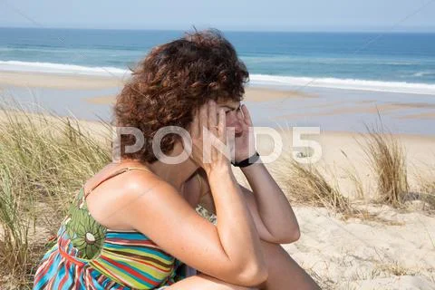 Profile view woman with headache, touching her face by hands Stock Photos