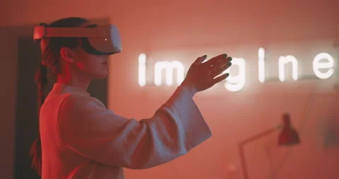 Profile view of a young woman using and taking off virtual reality glasses Stock Footage 201130929