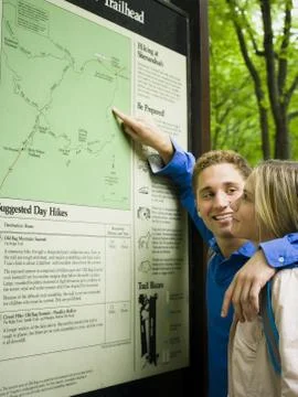 Profile of a young couple looking at a map Fotos Stock