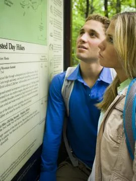 Profile of a young couple looking at a map Fotos Stock