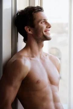 Profile of young man smiling, bare torso Stock Photos