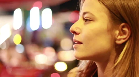 Profile of young woman in amusement park Stock Footage 59556278