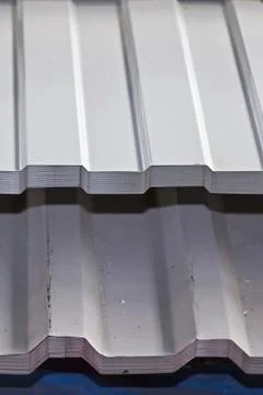 Profiled galvanized sheet with polymer coating in packs in the warehouse of m Stock-Fotos