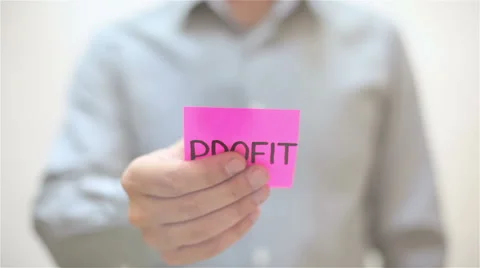Profit. A man sticks a note on transparent screen Stock Footage