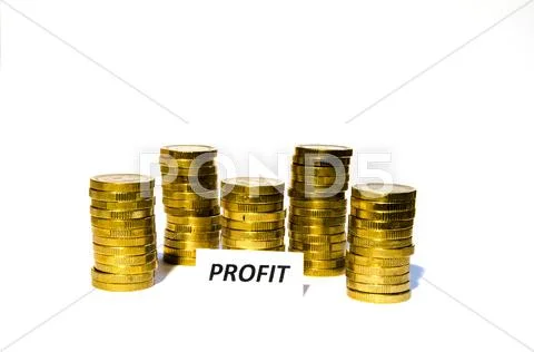 Profit sign at coin piles Stock Photos
