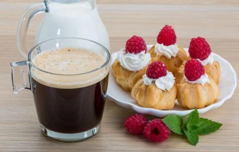 Profiterole with raspberry Stock Photos
