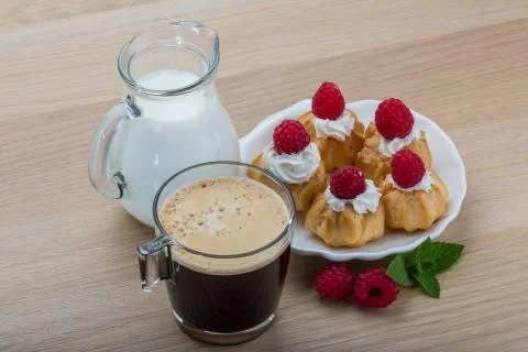 Profiterole with raspberry Stock Photos