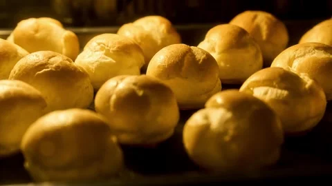 Profiteroles baking in oven. Timelapse of profiterole production. Homemade food Video stock 262336632